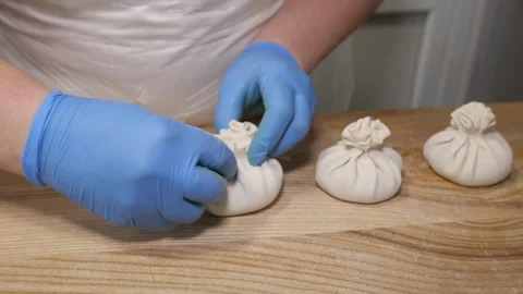 Professional chef making traditional georgian khinkali dumplings Stock Footage 331248231