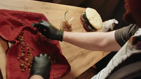 Professional chef meticulously organizing dried raisin for recipe Video stock 330536701