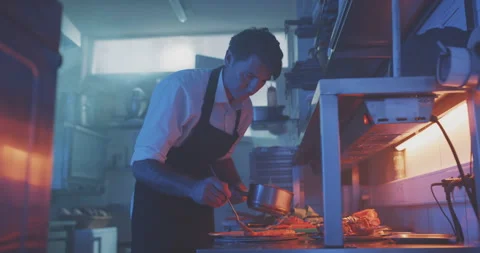 Professional chef plating finished meal Stock Footage 203560088
