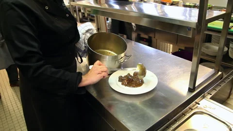 Professional Chef Plating Flemish Beef Stew in Commercial Restaurant Kitchen Stock Footage 343842860