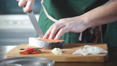 Professional chef prepare salmon before to cook food at kitchen restaurant. 動画素材 124709234
