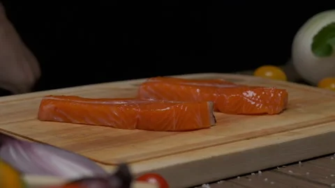 Professional chef prepares fish steak for frying. Close up slow motion. Stock Footage 140111496