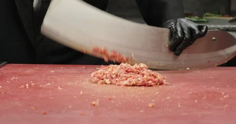 Professional chef prepares minced meat with a big knife or axe. Handmade minced Stock Footage 265094476