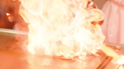 A professional chef prepares shrimp in the restaurant kitchen. Professional Stock-Footage 232562632