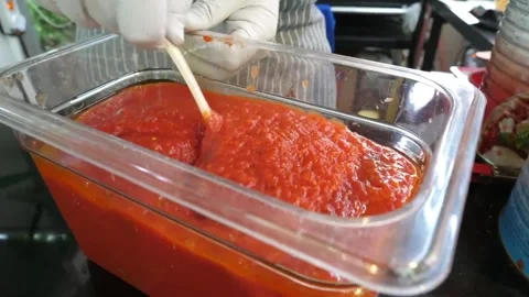Professional Chef Preparing Authentic Italian Tomato Pizza Sauce in Commercial K Stock Footage 337676671