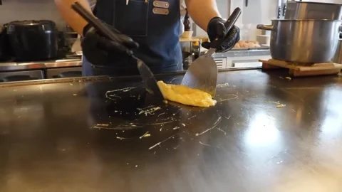 Professional Chef Preparing Fluffy Scrambled Eggs on Flat Top Teppanyaki Griddle Video stock 347688680