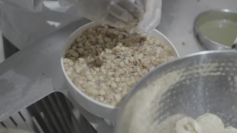 Professional chef preparing fresh chickpea salad in a commercial kitchen Stock-Footage 335270882