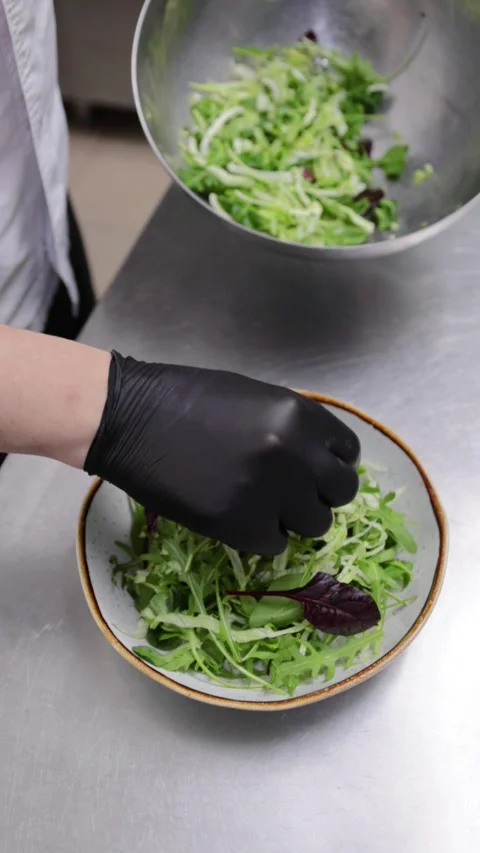 Professional chef preparing a fresh salad Stock Footage 326895325