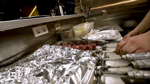 Professional chef preparing meat on grill. Cooking meat at the restaurant Stock Footage 104018133