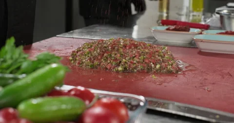 Professional chef preparing vegetarian salad dip sauce traditional Turkish ezme Stock Footage 294223094