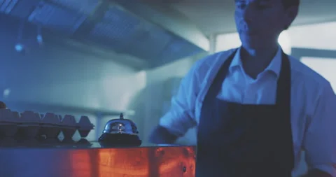 Professional chef pressing bell in the kitchen to give signal Stock Footage 203558684