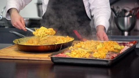 Professional chef puts hot pumpkin curry on pieces fresh fish. Stock Footage 88944772