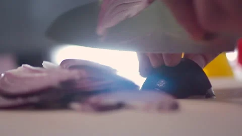 Professional chef quickly slices onions with a large sharp knife Stock Footage 194150081