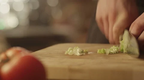 Professional Chef is Rapidly Chopping Spring Onion in Kitchen Stock Footage