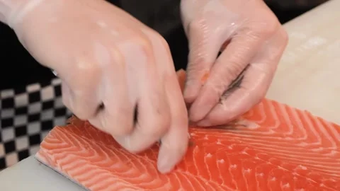 Professional Chef Removing Pin Bones from Fresh Salmon Fillet with Tweezers Stock Footage 333521946