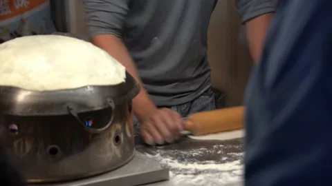 Professional chef roll the dough with rolling pin and flip the side of 스톡 동영상 204610604