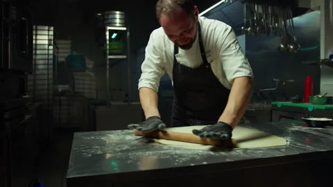 Professional Chef Rolls Out Dough To Make Stuffed Ravioli In A Hotel Kitchen Video stock 278983417