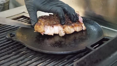 Professional Chef Searing Premium Steak on Cast Iron Griddle Stock Footage 332815249