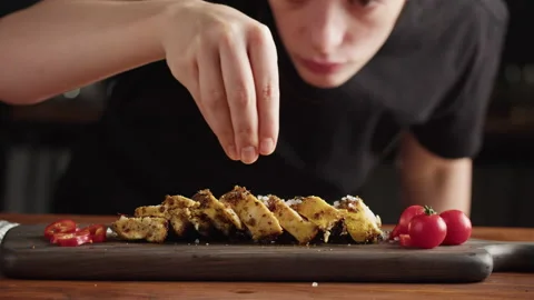 Professional Chef serving chicken breast with salt, meat grill steak with spices Stock Footage 169194943