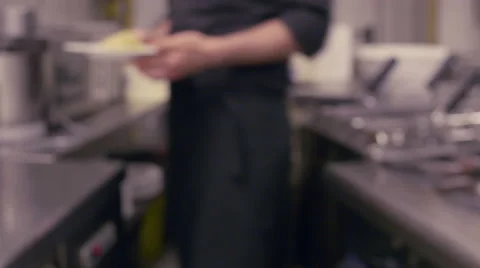 Professional chef showing dish to camera Stock Footage 64721436