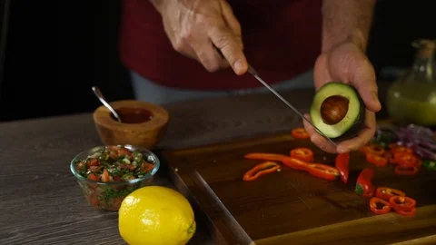 Professional Chef Skilfully Cuts Avocado Stock Footage 104983151