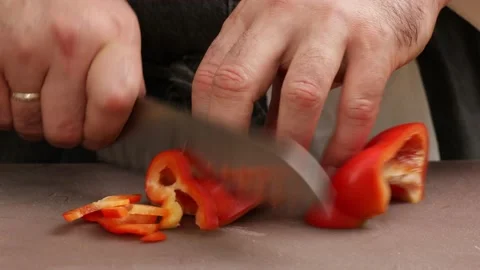 A professional chef slices a tomato. Stock Footage 160967941