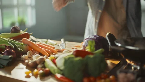 Professional chef slicing a carrot Stock Footage 311834930