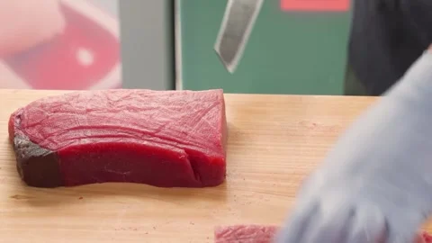 Professional Chef Slicing Fresh Bluefin Tuna Fillet for Sashimi and Sushi Stock Footage 333499199