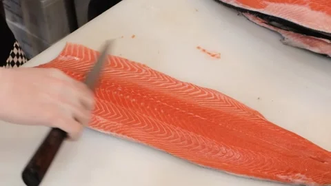 Professional Chef Slicing Fresh Raw Salmon Fillet on White Cutting Board Stock Footage 333489136