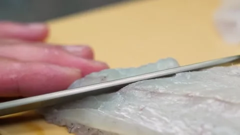 Professional Chef Slicing Fresh Raw White Fish Fillet for Sashimi Stock Footage 333495713