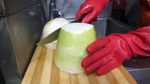 Professional Chef Slicing Large Korean Radish for Fish Cake Production Stock Footage 337374182