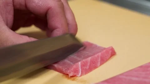 Professional Chef Slicing Premium Bluefin Tuna Otoro for Sashimi Stock Footage 333526312