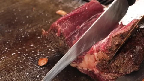 Professional Chef Slicing Premium Wagyu Beef Steak on Hot Teppanyaki Grill Stock Footage 333520897