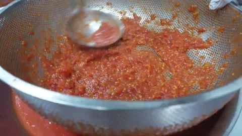Professional Chef Straining Fresh Tomato Pulp for Authentic Italian Pizza Sauce Stock Footage 337678158