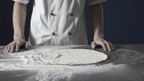 Professional chef stretching a pizza dough Stock Footage 127414440