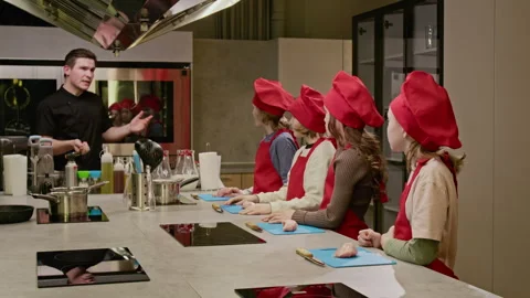 Professional Chef Teaching Group of Children in Cooking Class Stock Footage 339475563