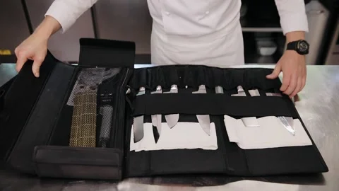 Professional chefs, cooking knife set in black case on the kitchen. Man's hands Vídeos de archivo 131336252