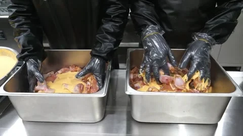 Professional Chefs Marinating Raw Chicken Pieces in Large Stainless Steel Kitche 스톡 동영상 343028776