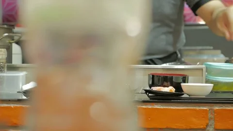 Professional chefs preparing and cooking food in a kitchen. Stock Footage 77441551