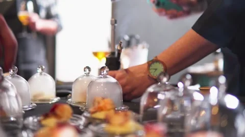 Professional chefs using smoke gun device to aromatize octopus on glass Stock Footage 269063019