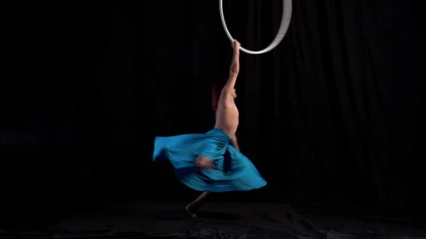 Professional circus artist performing dance on aerial hoop in flaring blue skirt Vídeos de archivo 158183473