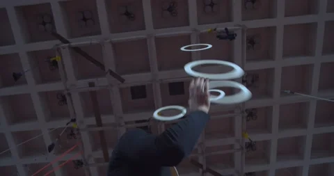 Professional circus juggler is performing on the training, juggling the rings 4k Stock Footage 147191629