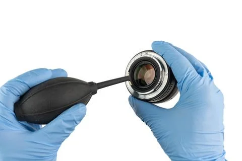 Professional cleaning of a camera objectives with a bellow Stock Photos