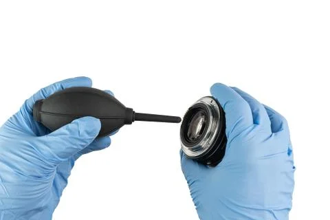Professional cleaning of a camera objectives with a bellows and gloves Stock Photos