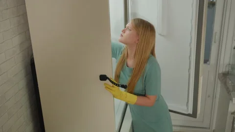 Professional cleaning expert examining bathroom wall grout. Bright bathroom Stock Footage 336862911