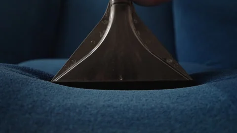 Professional cleaning service worker using washing vacuum cleaner with Stock Footage 312376997