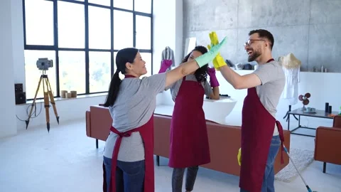 Professional Cleaning Team in Modern studio Stock Footage 279493102