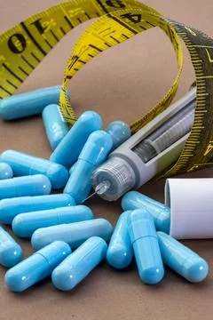 Professional close-up of blue pharmaceutical capsules, a medical injection .. Stock Photos