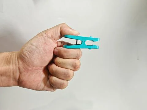 Professional Close-up of Teal Plastic Spring-Loaded Clothespin on White Back Stock Photos