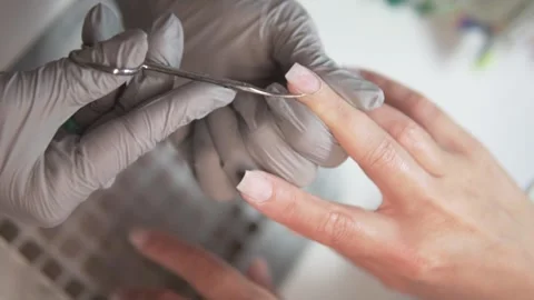 Professional close-up video of a manicure procedure in a beauty salon. A nail Stock Footage 311872633